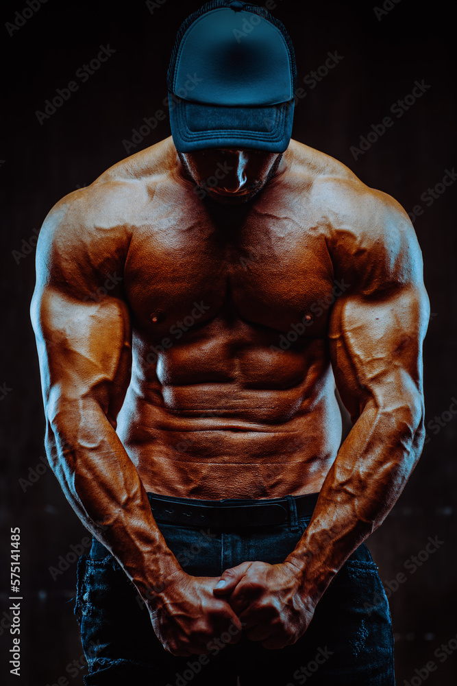 Naklejka premium Young strong man bodybuilder