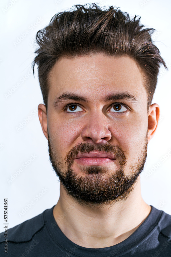 Fototapeta premium Young dissatisfied man portrait