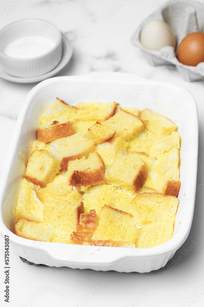Bread pudding with caramel sauce on top. White background. Bread pudding with caramel sauce on top. White background.
