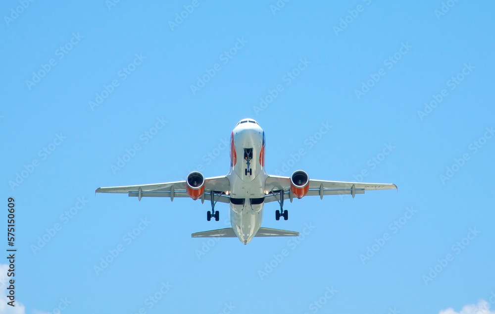 Fototapeta premium White airplane with take off from the airport.