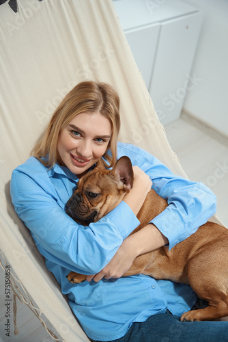 Happy woman enjoying rest with her dog
