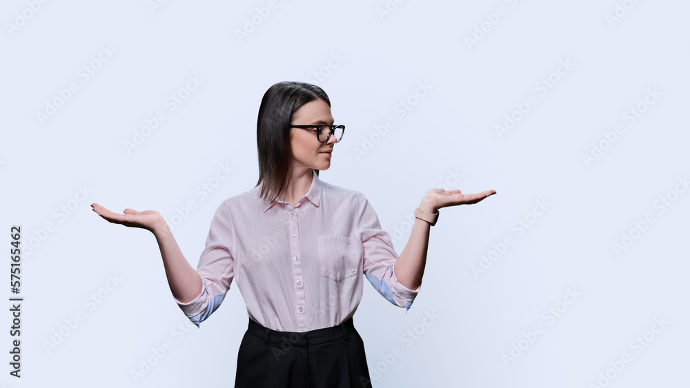 Business woman holding two hands with empty open palms on white background Business woman holding two hands with empty open palms on white background