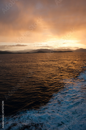 Early morning on the ferry boat from Igoumenitsa to Corfu. The sun rises behind the mountains of Thesprotia region  Epirus  Greece