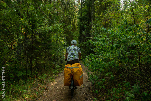 person riding a bike in a forest