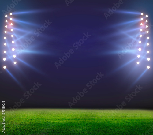 Green soccer field, bright spotlights, illuminated stadium 