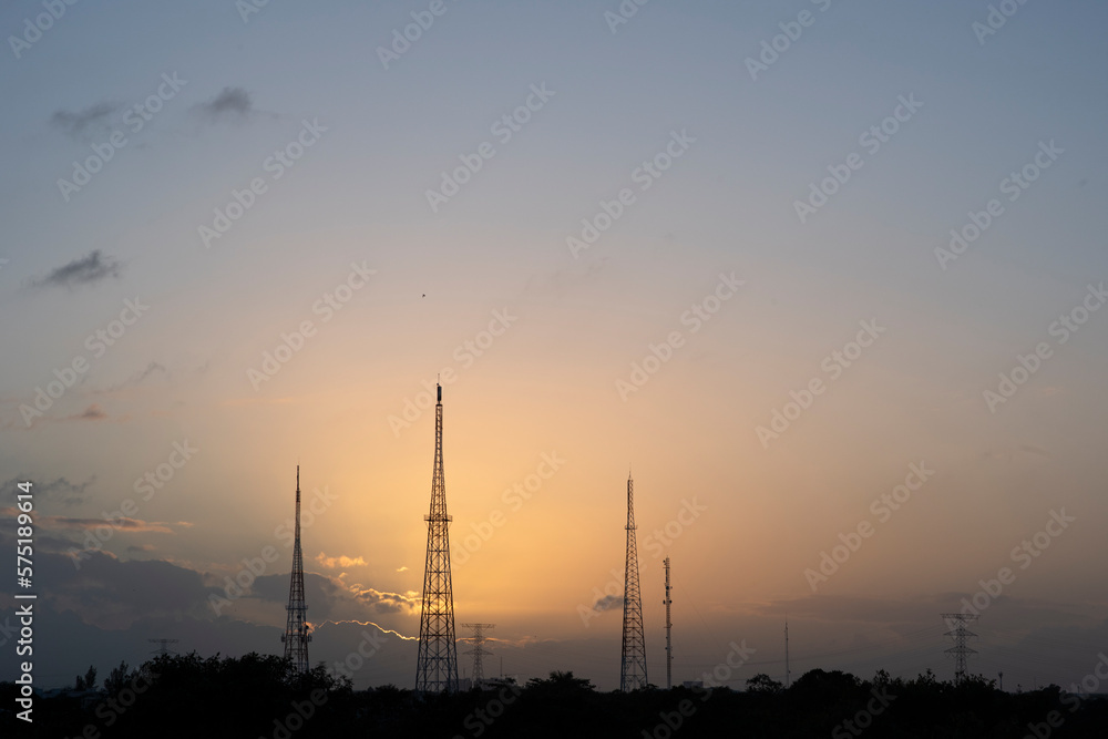 An electric Pylons Amidst the Sunset in Playa del Carmen, Mexico