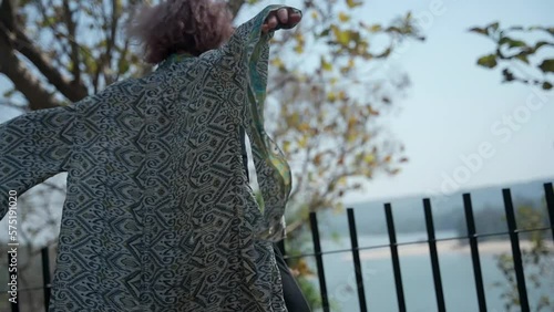 Beautiful woman dancing in slow motion video against the backdrop of wildlife