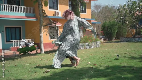 Attractive girl dancing in nature demonstrating dancing skills