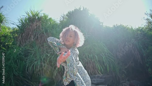 In this slow-motion video, the beauty in the dress presents her dance.