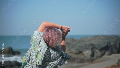 In the video, a charming girl in a dress shows her energetic dance