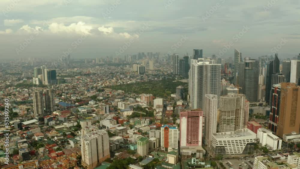 Manila city with skyscrapers, modern buildings and Makati business center, aerial drone. Travel vacation concept. Manila city with skyscrapers, modern buildings and Makati business center, aerial drone. Travel vacation concept.