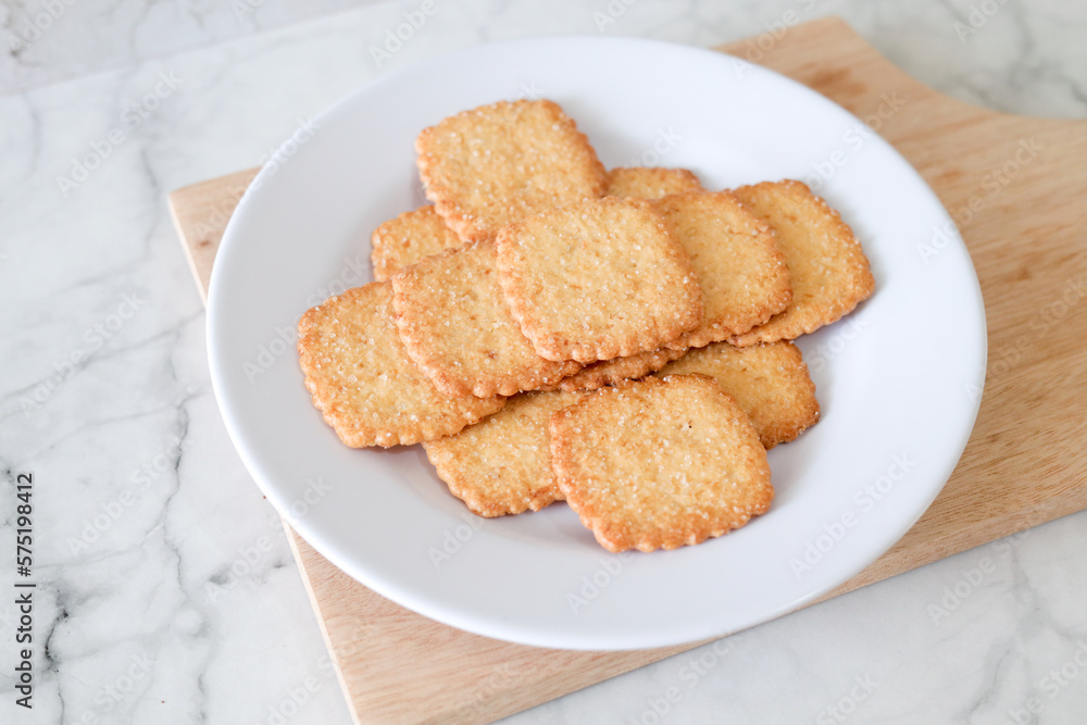 Potato chips biscuit on a white plate. Delicious crispy potato chips biscuits in plate. Space for text. Top view. Sweet potato buttermilk biscuits homemade for breakfast Potato chips biscuit on a white plate. Delicious crispy potato chips biscuits in plate. Space for text. Top view. Sweet potato buttermilk biscuits homemade for breakfast