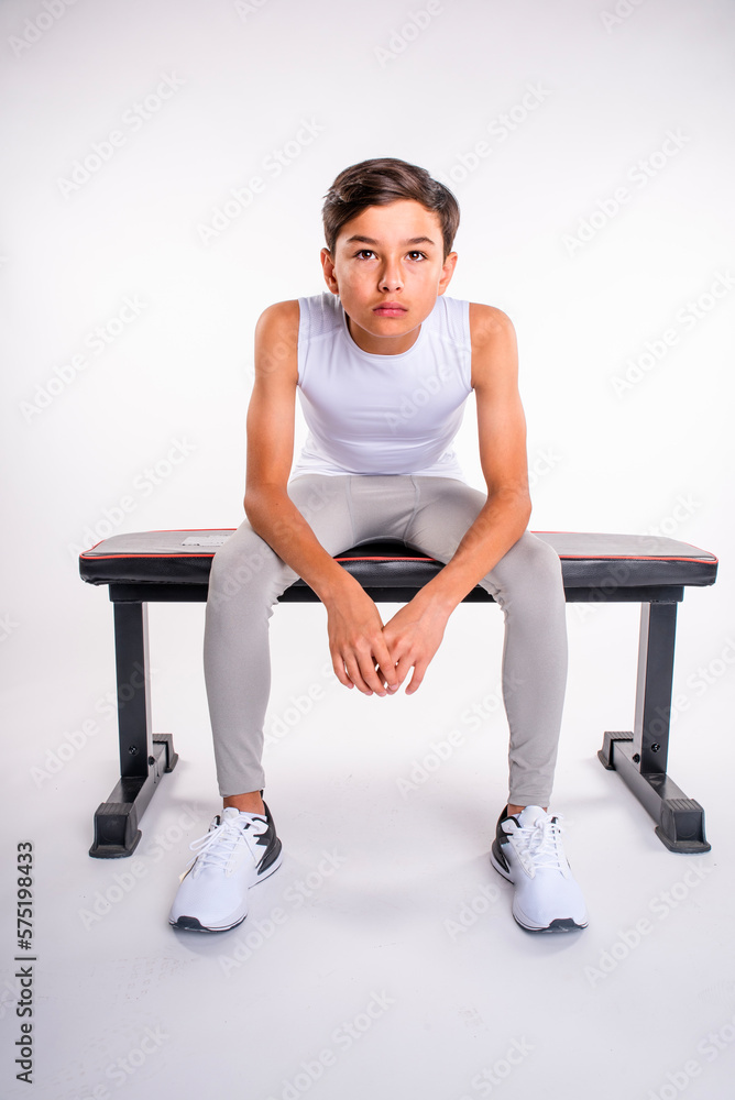 Athletic young male sitting on a bench waiting for action
Athletic young male sitting on a bench waiting for action