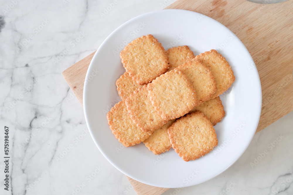 Potato chips biscuit on a white plate. Delicious crispy potato chips biscuits in plate. Space for text. Top view. Sweet potato buttermilk biscuits homemade for breakfast Potato chips biscuit on a white plate. Delicious crispy potato chips biscuits in plate. Space for text. Top view. Sweet potato buttermilk biscuits homemade for breakfast