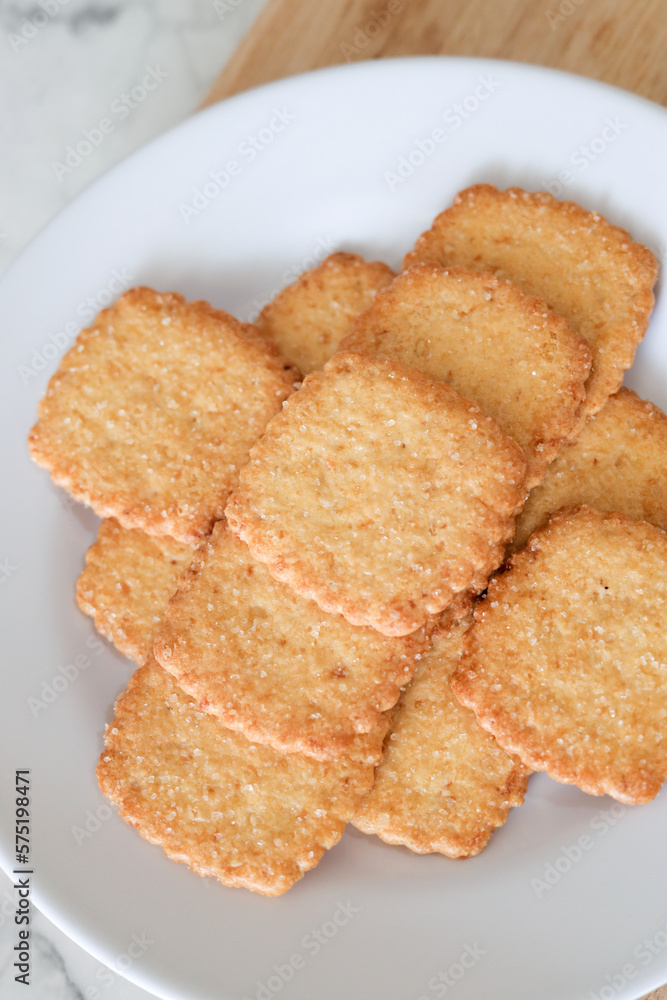 Potato chips biscuit on a white plate. Delicious crispy potato chips biscuits in plate. Space for text. Top view. Sweet potato buttermilk biscuits homemade for breakfast Potato chips biscuit on a white plate. Delicious crispy potato chips biscuits in plate. Space for text. Top view. Sweet potato buttermilk biscuits homemade for breakfast