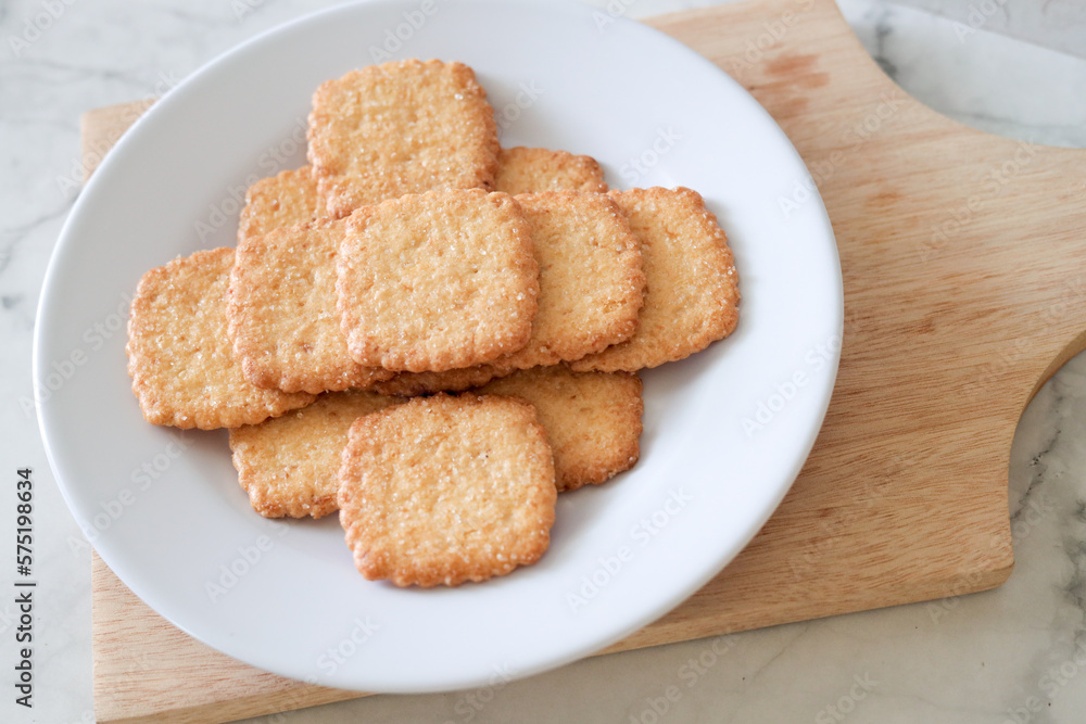 Potato chips biscuit on a white plate. Delicious crispy potato chips biscuits in plate. Space for text. Top view. Sweet potato buttermilk biscuits homemade for breakfast Potato chips biscuit on a white plate. Delicious crispy potato chips biscuits in plate. Space for text. Top view. Sweet potato buttermilk biscuits homemade for breakfast
