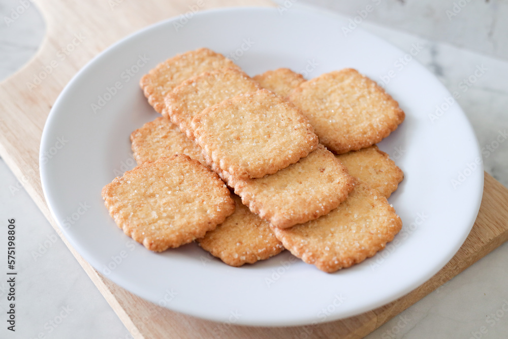 Potato chips biscuit on a white plate. Delicious crispy potato chips biscuits in plate. Space for text. Top view. Sweet potato buttermilk biscuits homemade for breakfast Potato chips biscuit on a white plate. Delicious crispy potato chips biscuits in plate. Space for text. Top view. Sweet potato buttermilk biscuits homemade for breakfast
