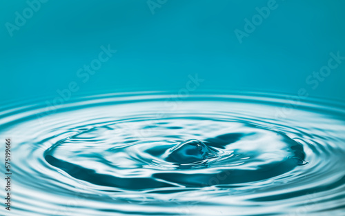 Water splash create ripple and bubbles background. Surface water wallpaper.