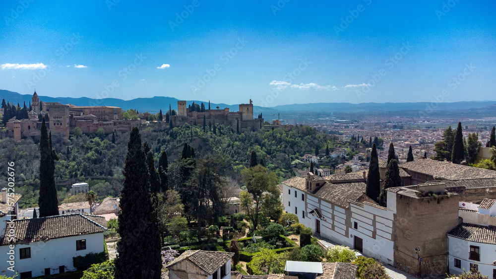 Sacromonte gypsy neighborhood with panoramic landscape and blue sky. Granada, Spain.