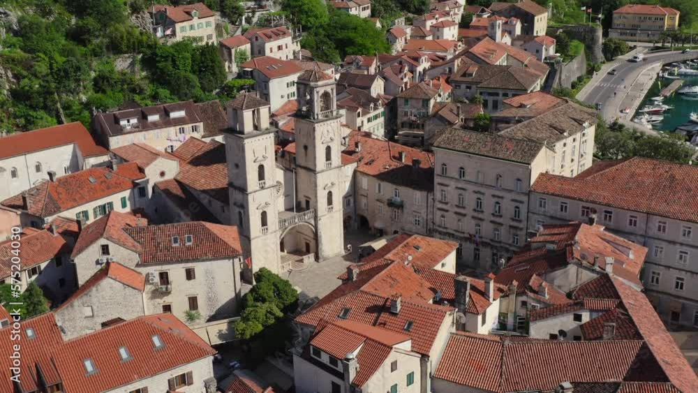 Kotor Old town in summer sunny day from drone. Aerial view Twin Towers Of St Tryphon Church in Kotor. Kotor Old town in summer sunny day from drone. Aerial view Twin Towers Of St Tryphon Church in Kotor.