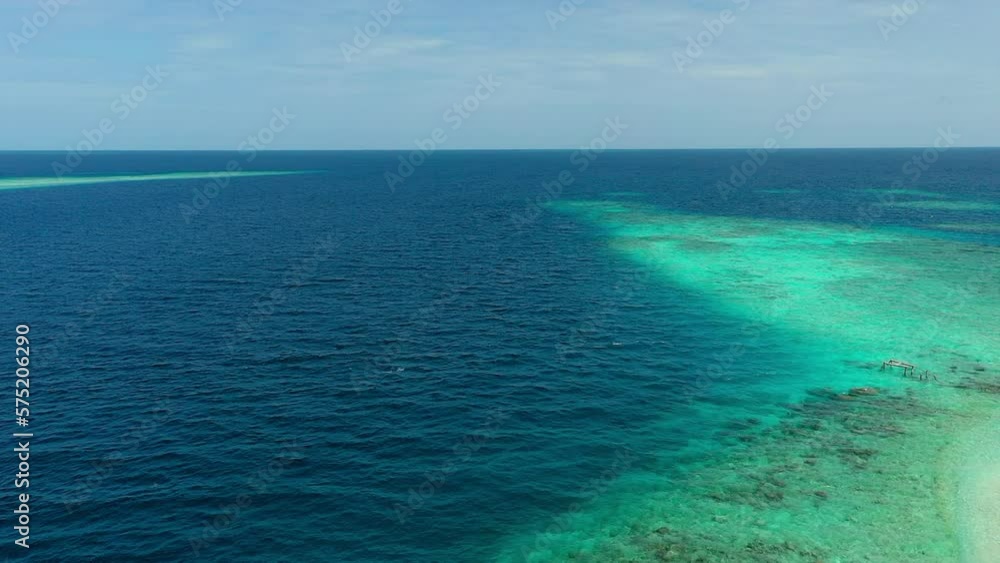 Aerial Beautiful View Of Turquoise And Blue Seascape, Drone Flying Forward On Sunny Day - Thulusdhoo, Maldives Aerial Beautiful View Of Turquoise And Blue Seascape, Drone Flying Forward On Sunny Day - Thulusdhoo, Maldives