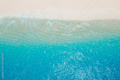 Tropical beach with sand and blue ocean. Aerial view of holidays beach in Seychelles