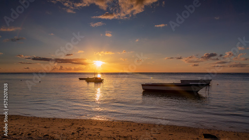 sunset on the tropical beach of Albion in the weat coast of the island of mauritius.