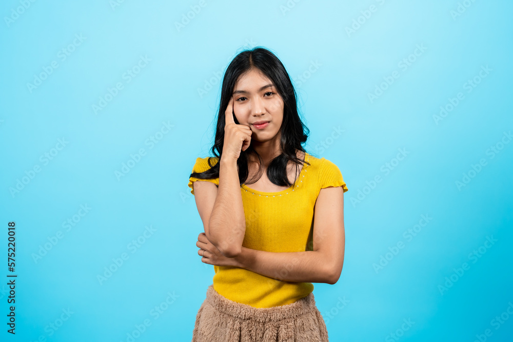 portrait, long haired girl wearing a shirt yellow tights, Standing laughing, he laughed hard, Until I had raise my hand cover my mouth, politely laugh, Isolated indoor studio on blue background. portrait, long haired girl wearing a shirt yellow tights, Standing laughing, he laughed hard, Until I had raise my hand cover my mouth, politely laugh, Isolated indoor studio on blue background.