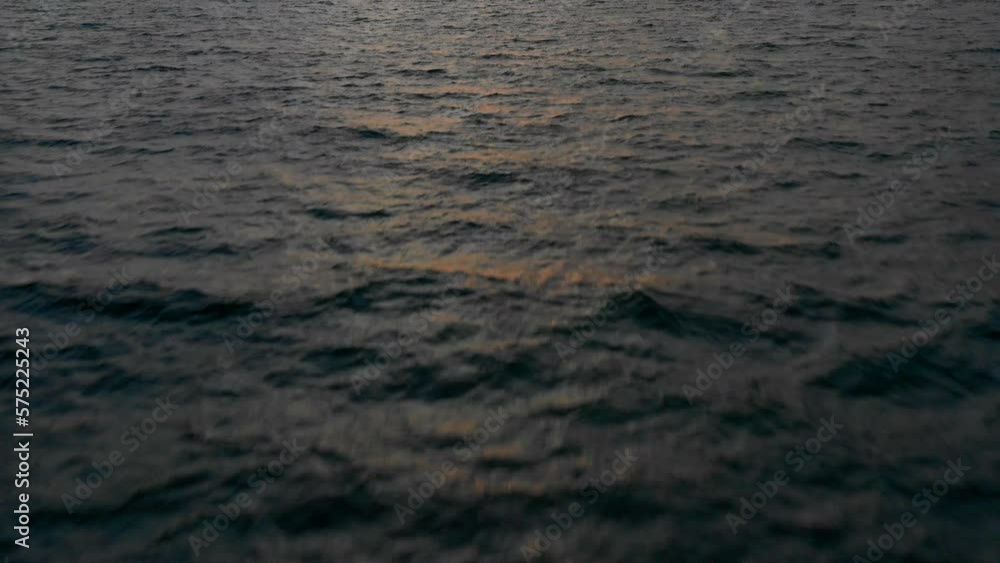 Aerial Forward Tilt Up Shot Of Nautical Vessels Moored On Wavy Sea Against Cloudy Sky During Sunset - Thulusdhoo, Maldives Aerial Forward Tilt Up Shot Of Nautical Vessels Moored On Wavy Sea Against Cloudy Sky During Sunset - Thulusdhoo, Maldives