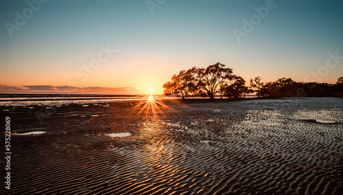 Scene of sunrise at the Nudgee Beach in Brisbane photo