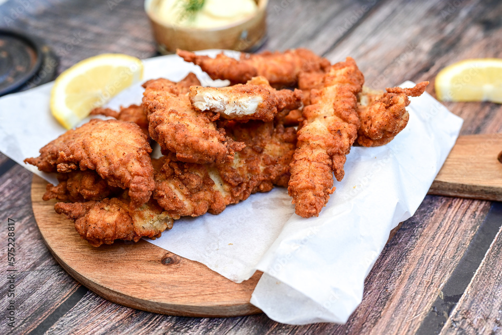 Crispy deep fried Chicken strips and wedges potato. Breaded with
