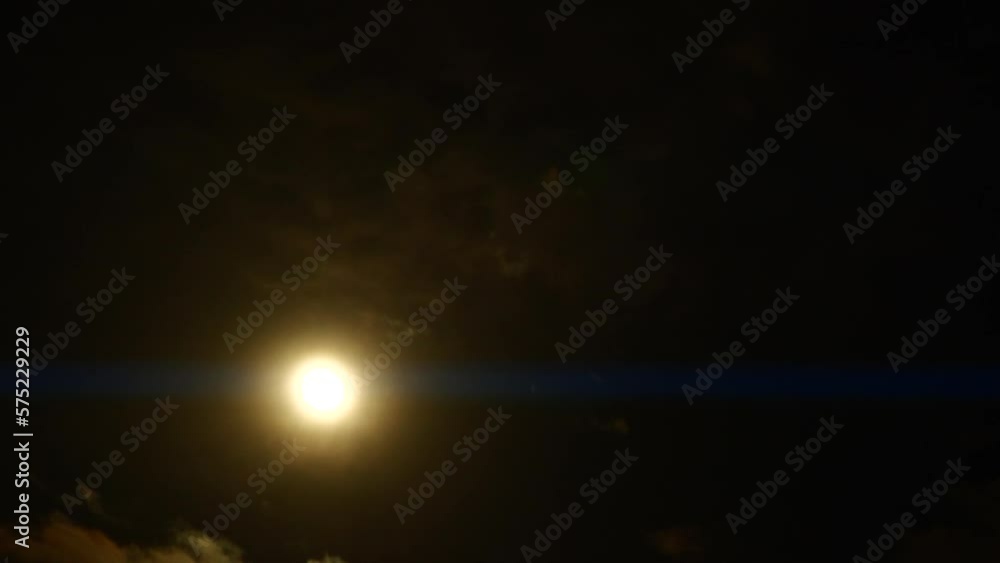 Timelapse of full moon, dark dramatic clouds in night sky, anamorphic time lapse Timelapse of full moon, dark dramatic clouds in night sky, anamorphic time lapse