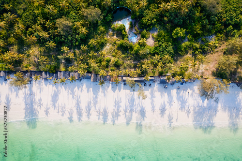 Indulge in a luxurious getaway at Zanzibar's Kiwengwa beach, where the white sand, turquoise waters, and palm trees create a serene and refreshing atmosphere for a truly memorable vacation. photo