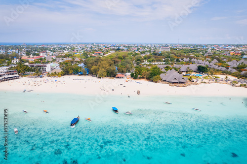 Spend your vacation in Zanzibar's picturesque Nungwi, where you can soak up the sun and admire the local fishing boats dotting the beach. © Sebastian