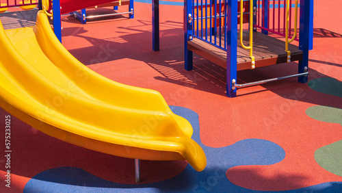 Bild auf Leinwand Slider with playground climbing equipment on colorful rubber floor in outdoors p