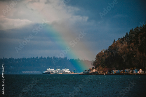A colorful rainbow over Puget Sound and ferry