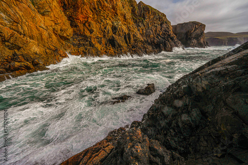 Waves crash on Arranmore Cliffs photo