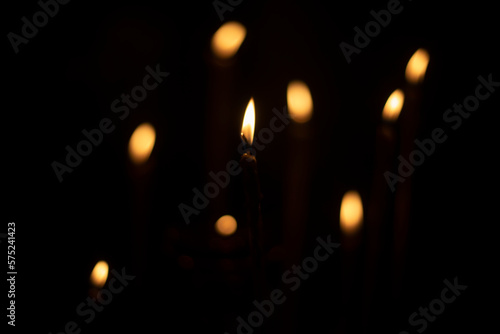 Candles burn in dark. Candle lights.
