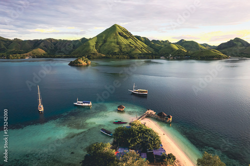 Beautiful aerial view of turquoise water with wooden pier, indonesioan photo