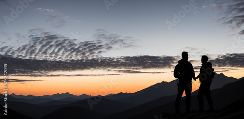 Silhouette of two person on top of mountain peak. / Holding Hands / coaching goal, success and teamwork concepts - Mountains Mountaineer / Space for Text / Blank Space / Copy Text