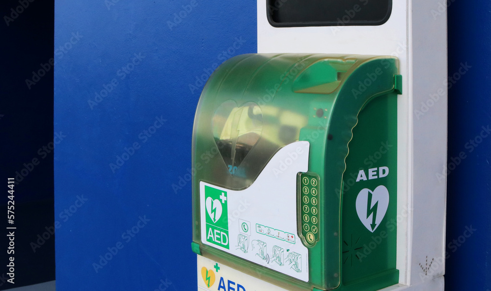 Automated external defibrillator or AED box in a public building for life saving.  - obrazy, fototapety, plakaty 