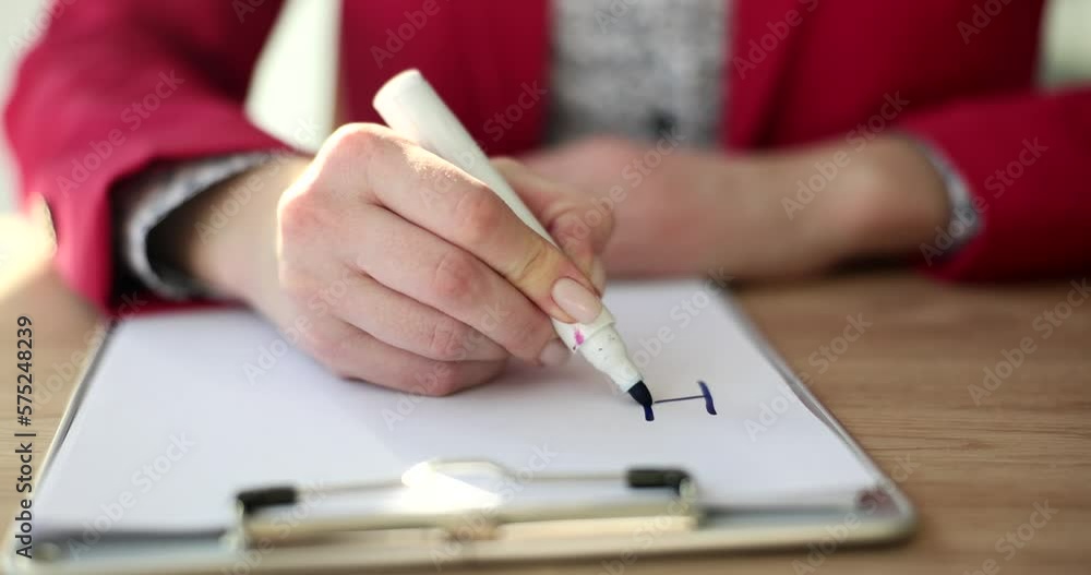 Woman hands write word help with marker Woman hands write word help with marker