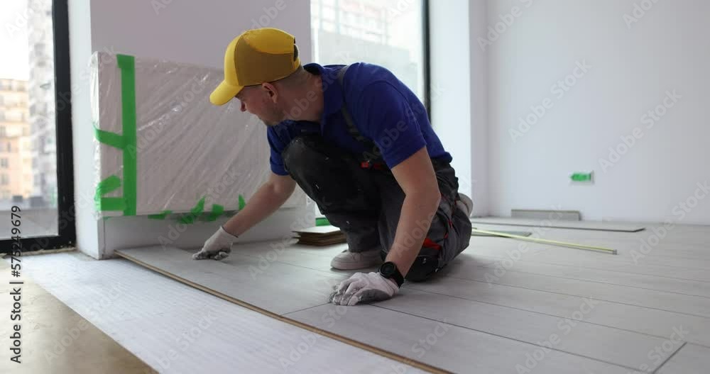 Master in floor installation and process of laying laminate on floor Master in floor installation and process of laying laminate on floor