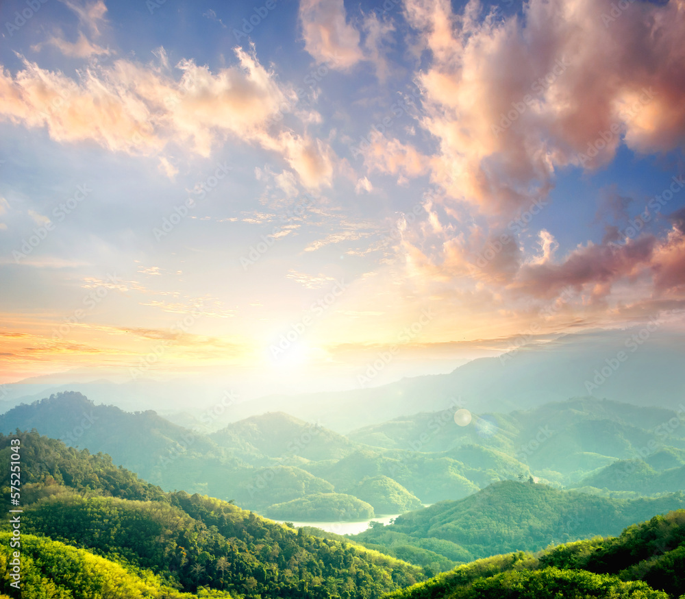 Sunrise over green forest with mountains and river background Sunrise over green forest with mountains and river background