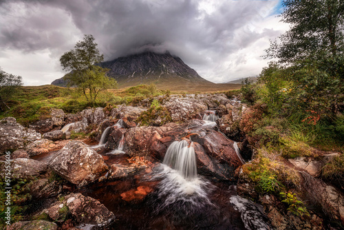 Waterfall on the River Coupall with Buachaille Etive Mor mountain in the background. Glencoe, Scotland. photo