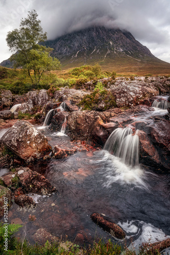 Waterfall on the River Coupall with Buachaille Etive Mor mountain in the background. Glencoe, Scotland.