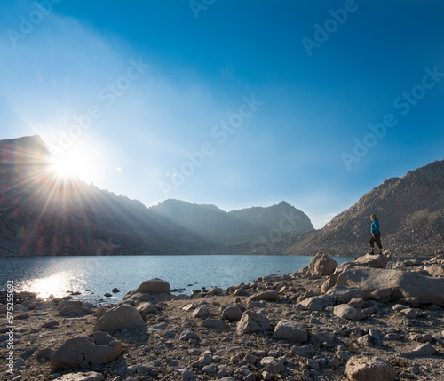 Sunstar and hiker looking over Royce Lakes, High Sierra