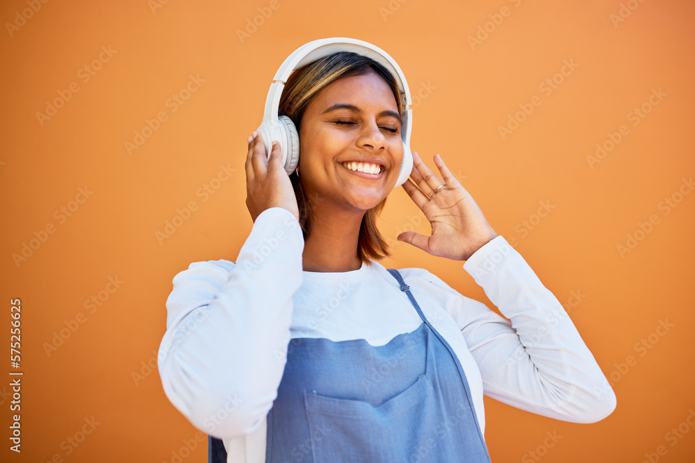 Mockup, wall and black woman with headphones, smile and streaming music against studio background. African American female, girl and headset for audio, relax and listen to radio, songs and podcast Mockup, wall and black woman with headphones, smile and streaming music against studio background. African American female, girl and headset for audio, relax and listen to radio, songs and podcast
