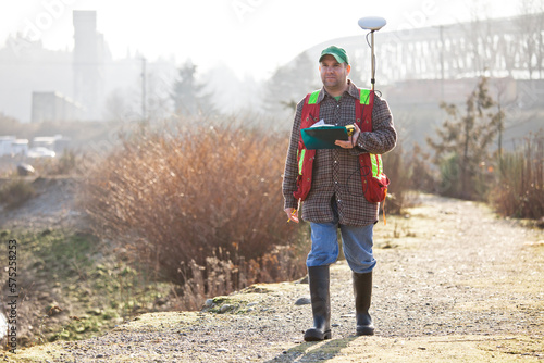 A Field Technician collects data with a GPS unit.