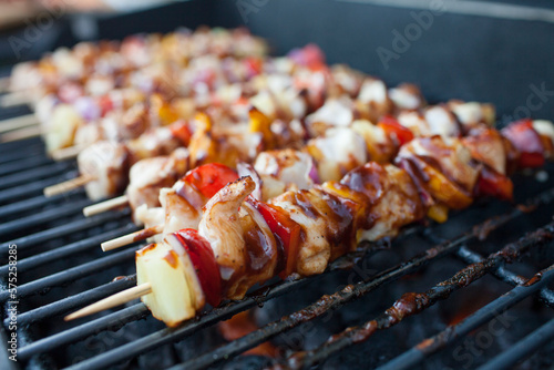 BBQ chicken skewers on the BBQ photo